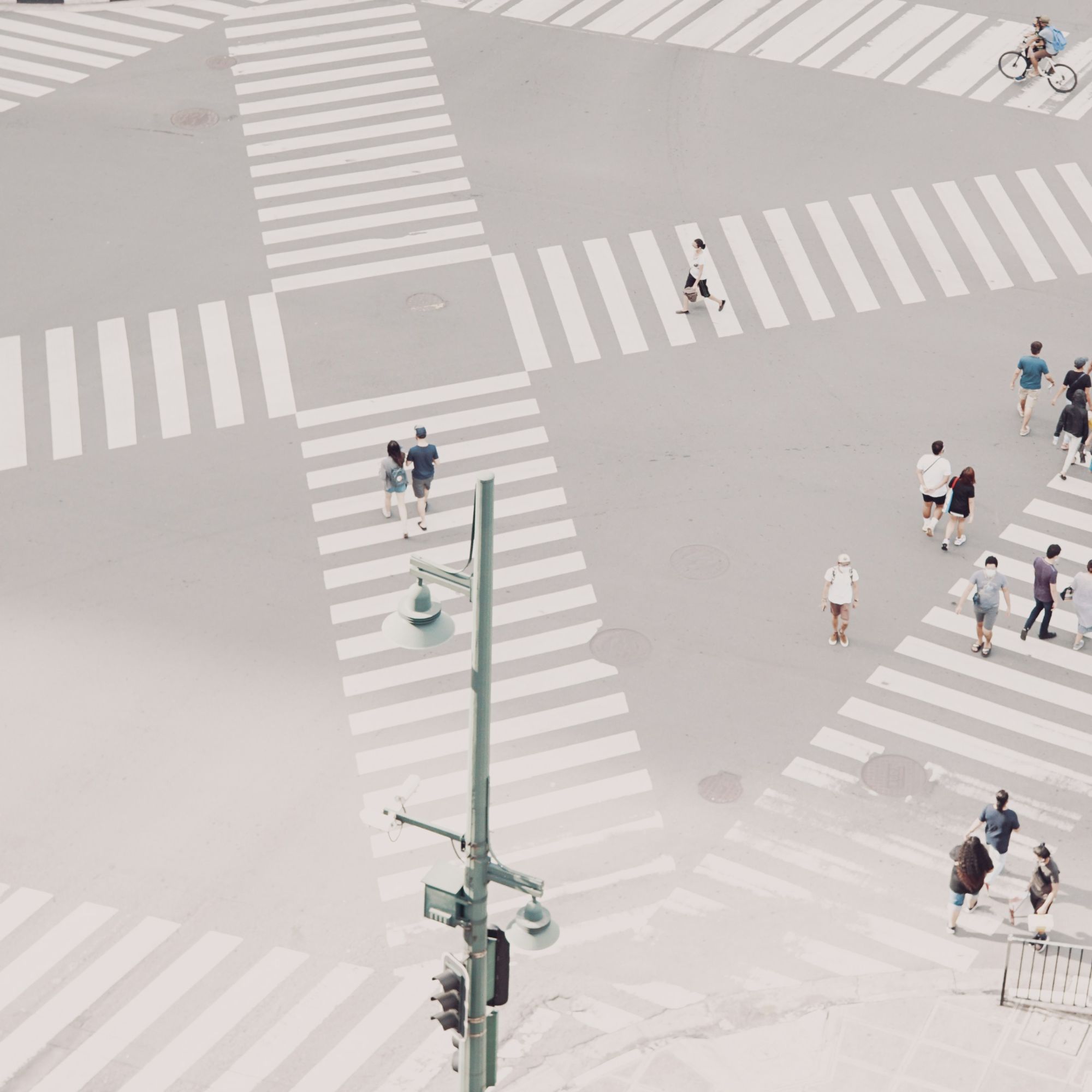 A pale city intersection seen from above, its crossings fanning out in several directions